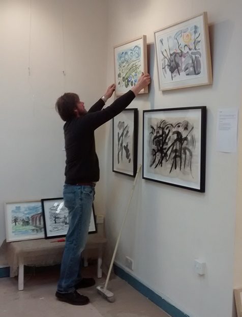 David hanging the pics at Bono Art Gallery 2014